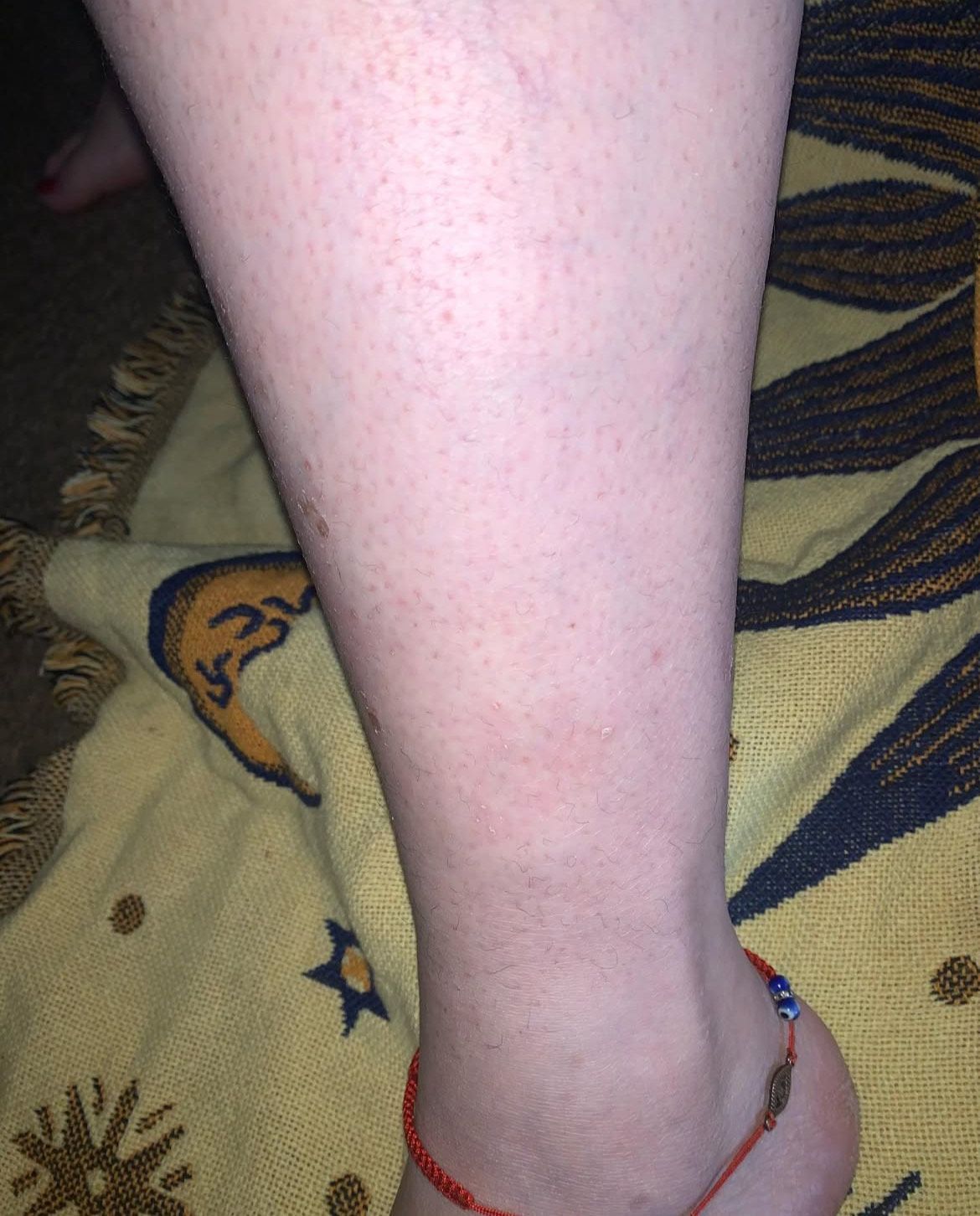 A close up of a person 's leg with a tattoo on it