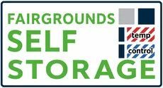Fairgrounds Self Storage sign with green text and temp control logo
