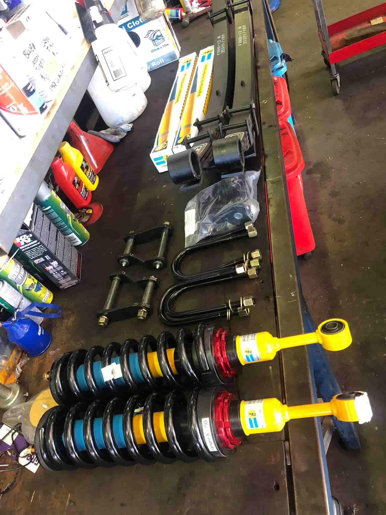 A Bunch of Shocks in A Garage — Torque Tyres & Trailer Spares Cairns in Cairns, QLD