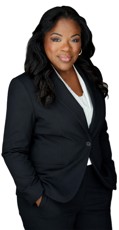 Lisa Wogwu in a black suit with hands in pockets, standing against a white background