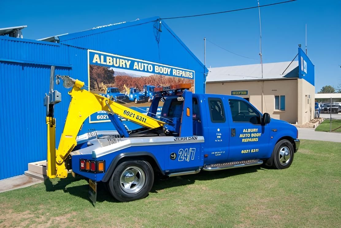 A Blue Tow Truck is Parked in Front of a Building — Crossborder Towing in South Albury, NSW