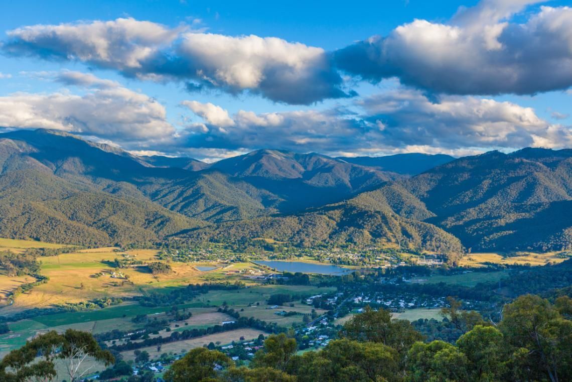 A View of a Valley With Mountains in the Background and a Lake in the Middle — Crossborder Towing in Mount Beauty, VIC
