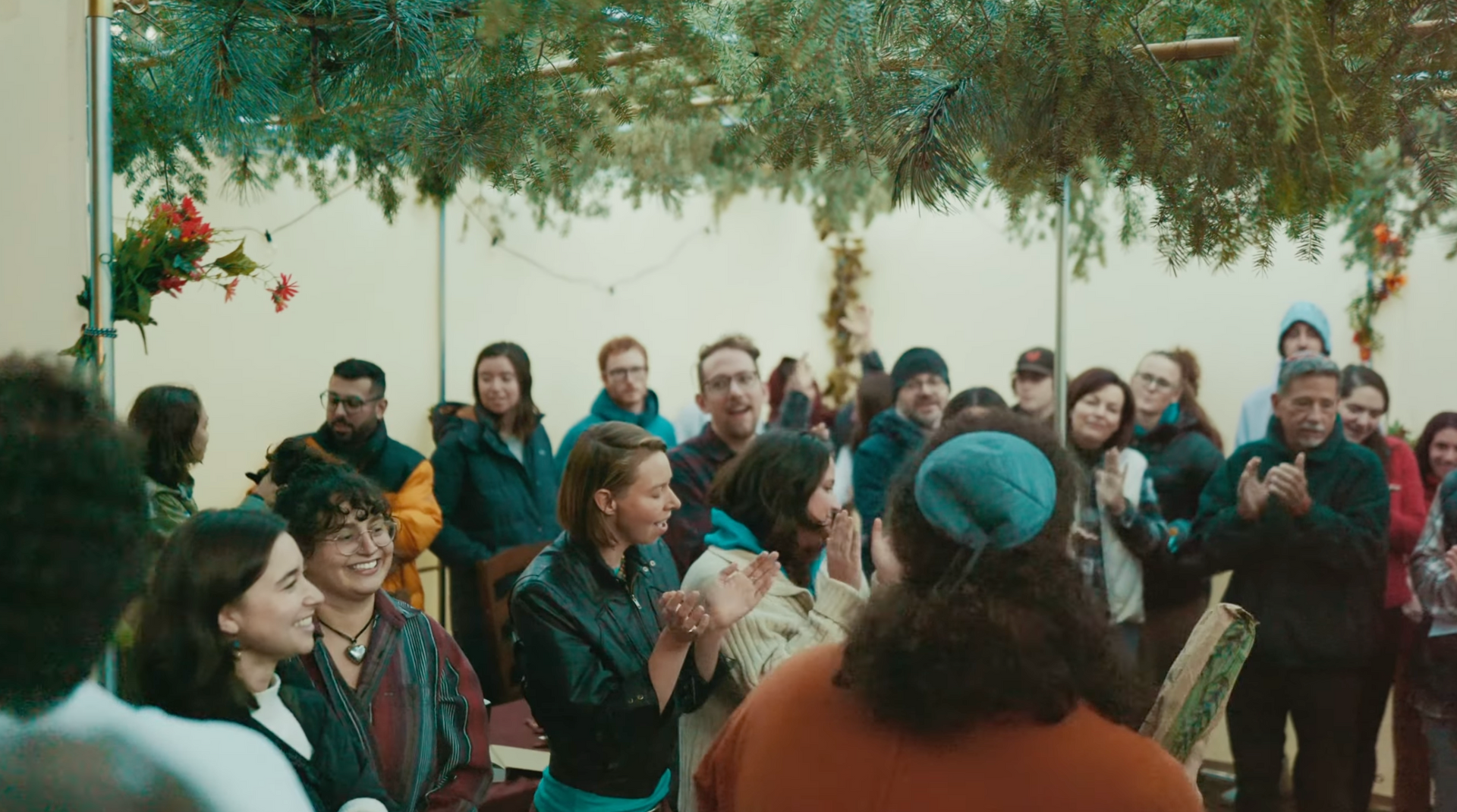 Group of people celebrating in a sukkah