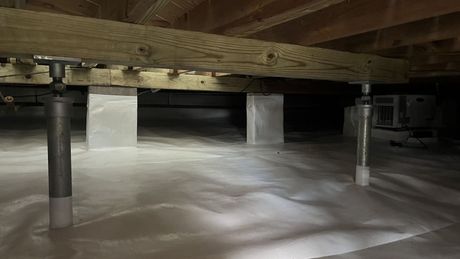 A close up of a metal structure in a basement.