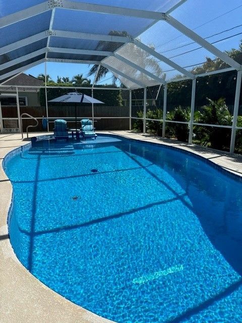 A large swimming pool with a canopy over it