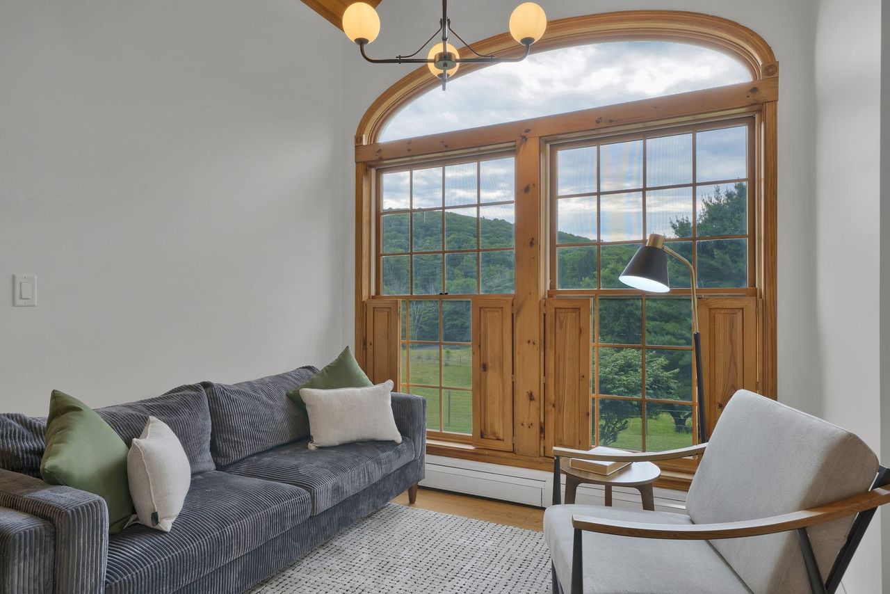 Great room with tall arched windows