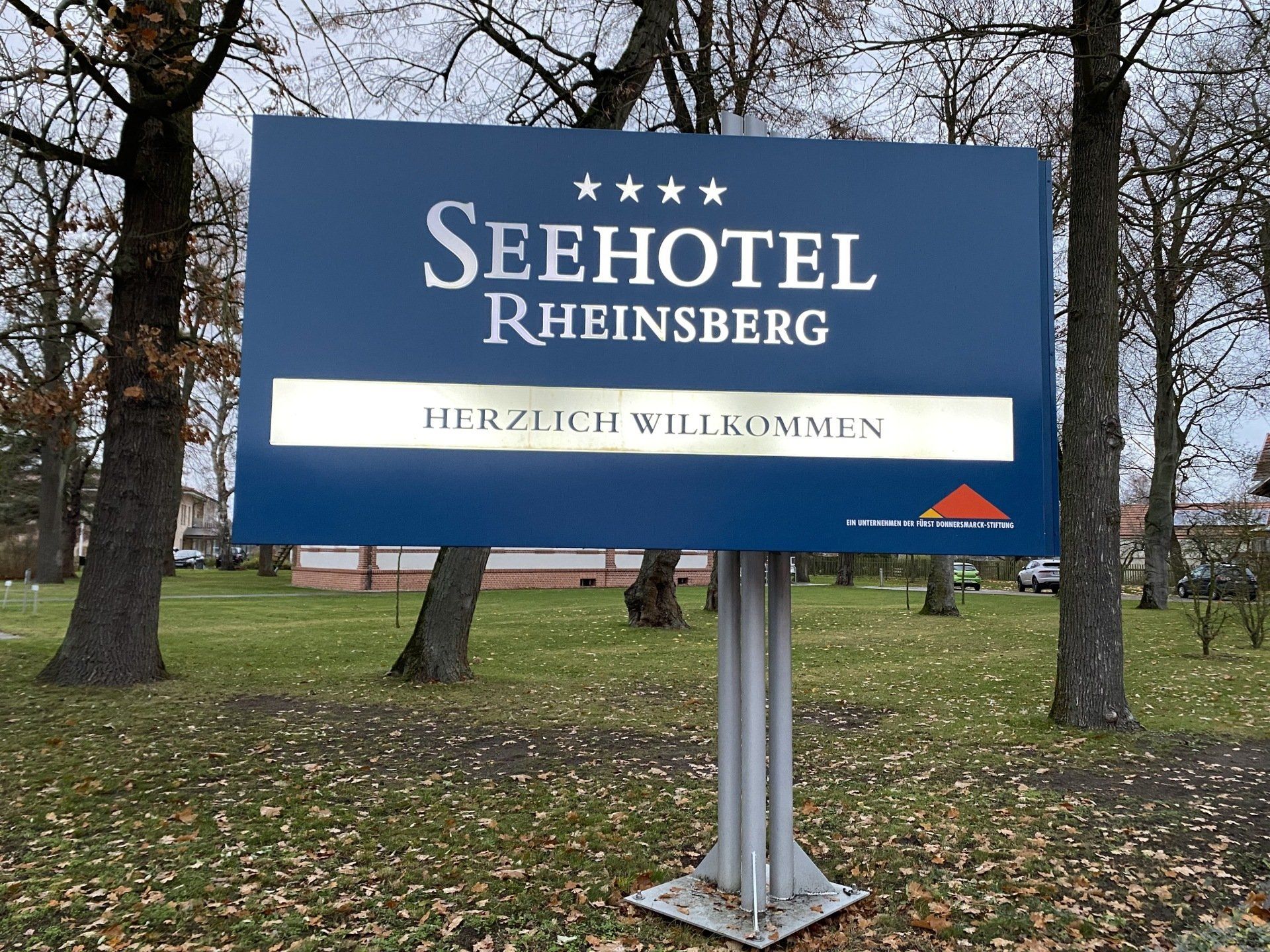 Sign for Seehotel Rheinsberg, dark blue with silver text, 