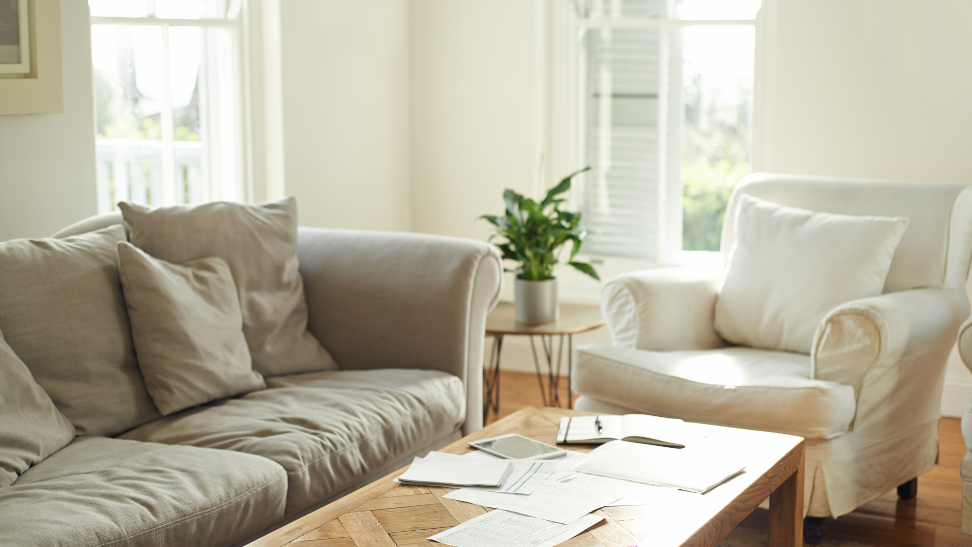 A living room with a couch , chair and coffee table