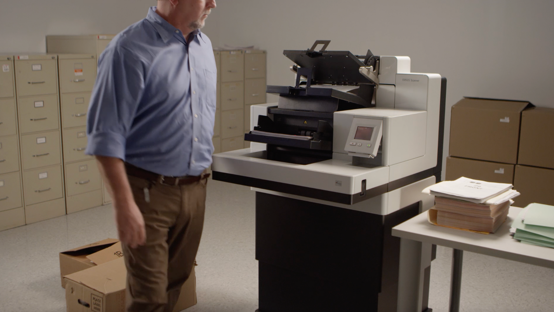 man operating a production scanner