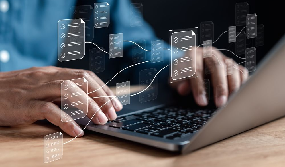Hands typing on a keyboard with a glowing AI icon floating above it in a dark setting