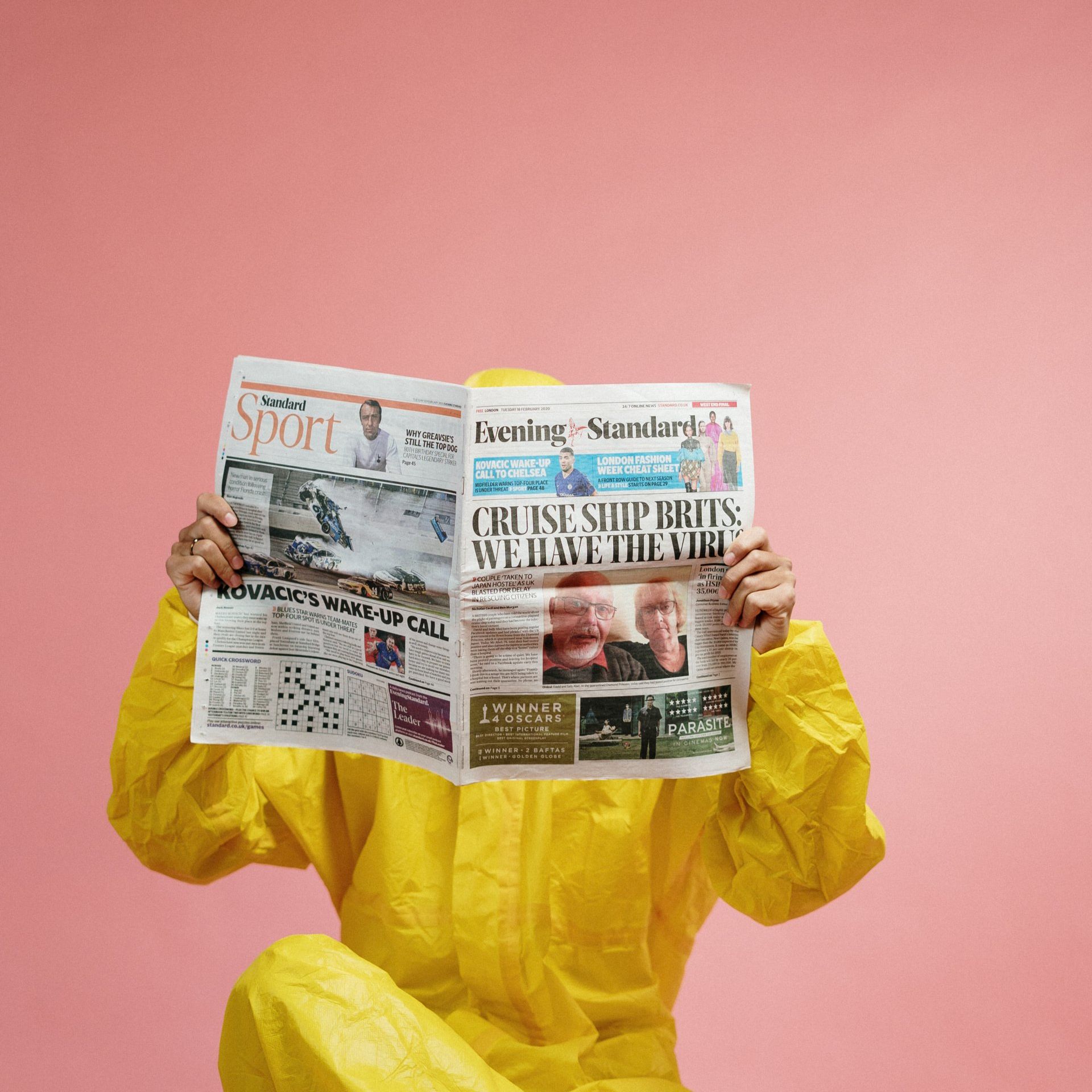 person reading newspaper 
