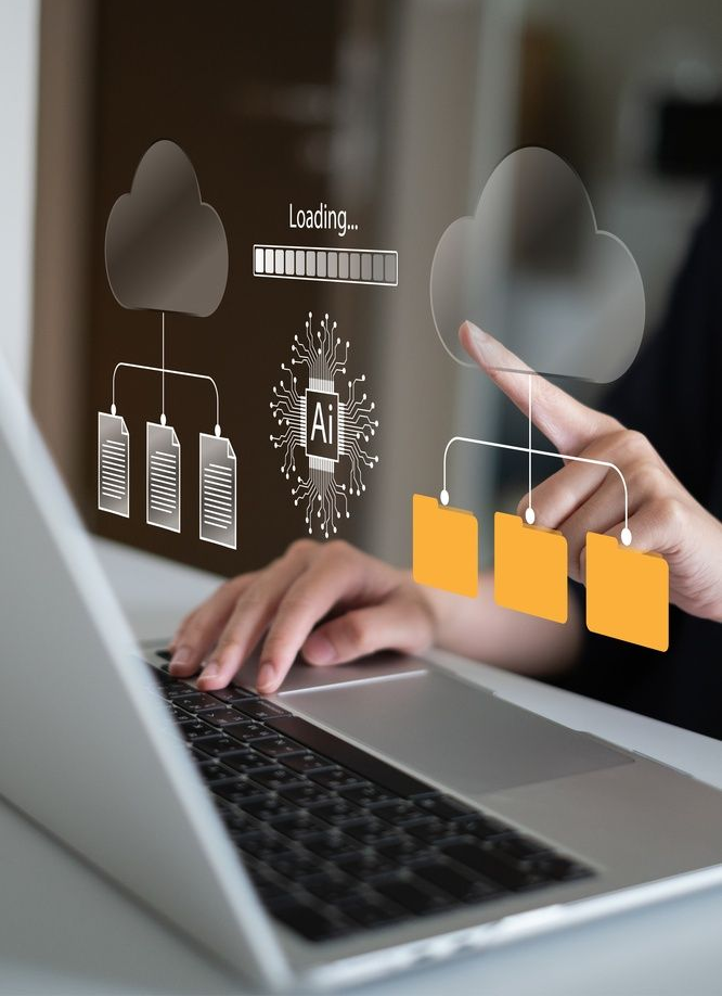 Hands typing on a laptop with cloud and AI icons overlayed, showing digital workflow and file sharing