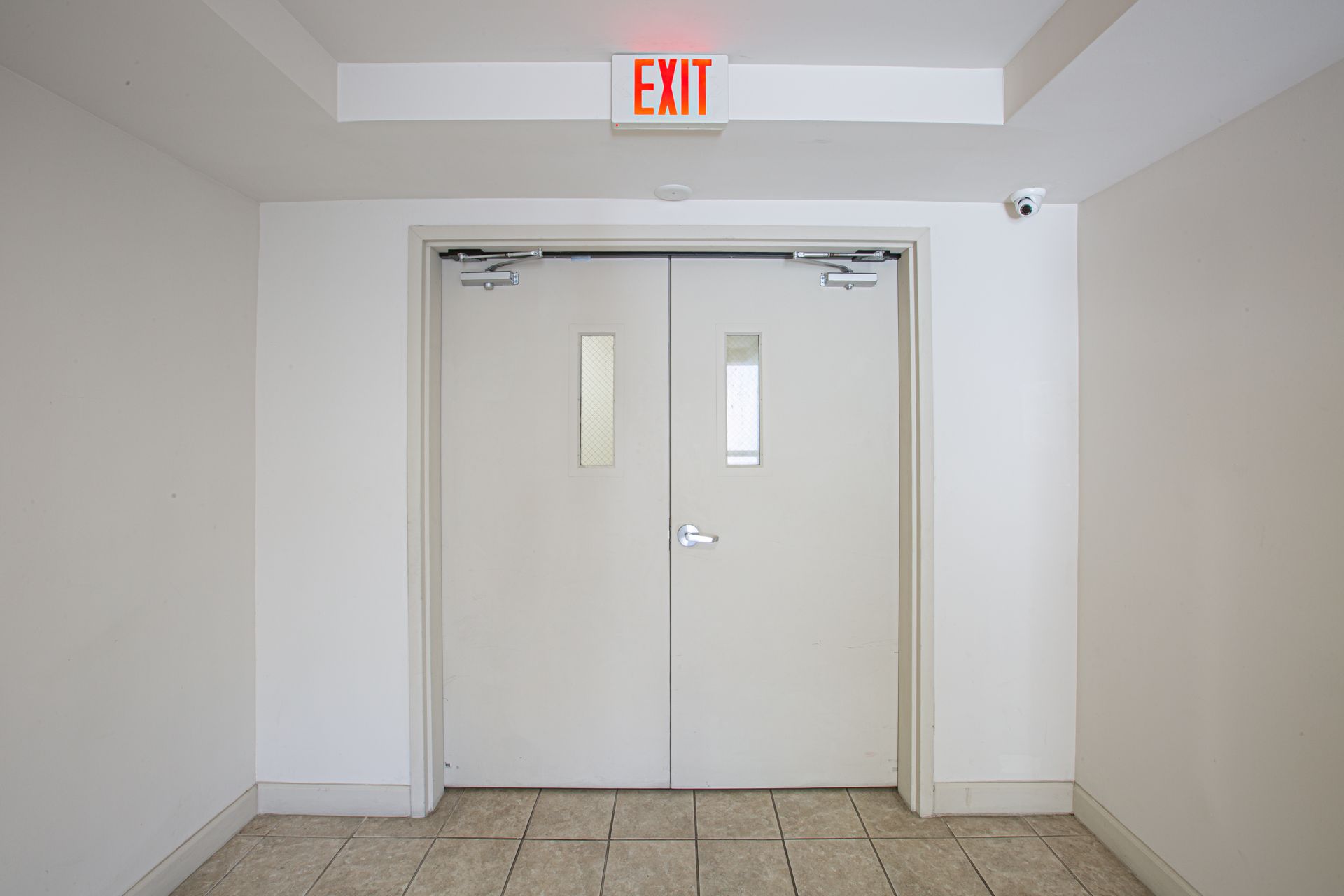 White double doors with narrow windows and an 
