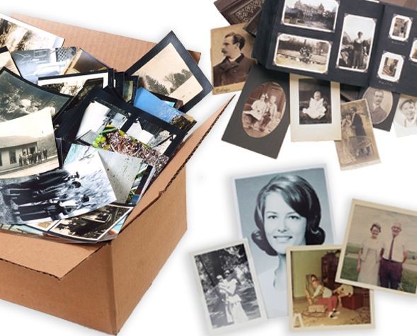 Scattered vintage family photos and negatives beside an open cardboard box