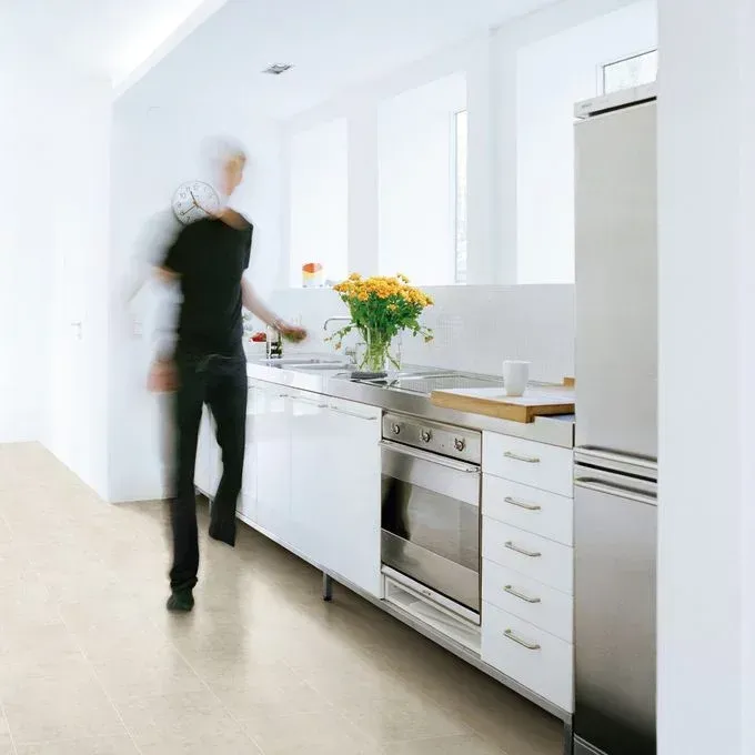 A blurry picture of a person in a kitchen
