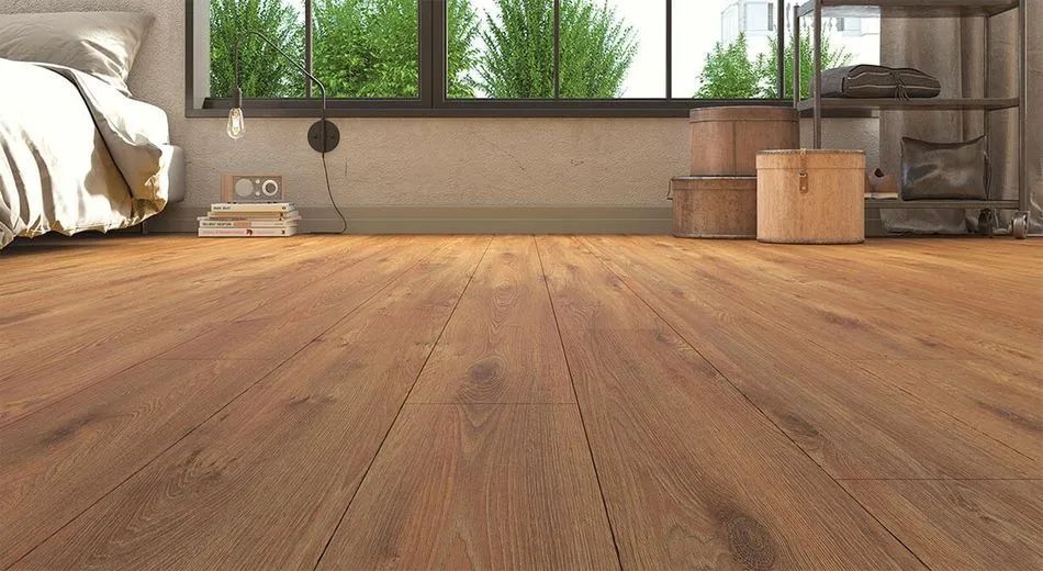 A bedroom with a wooden floor and a bed.