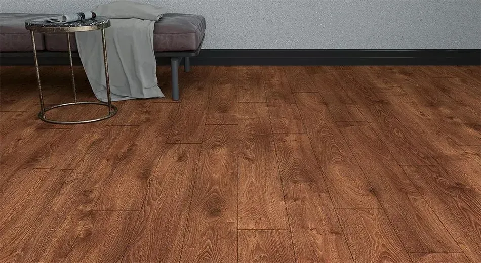 A living room with a wooden floor , a couch , and a table.