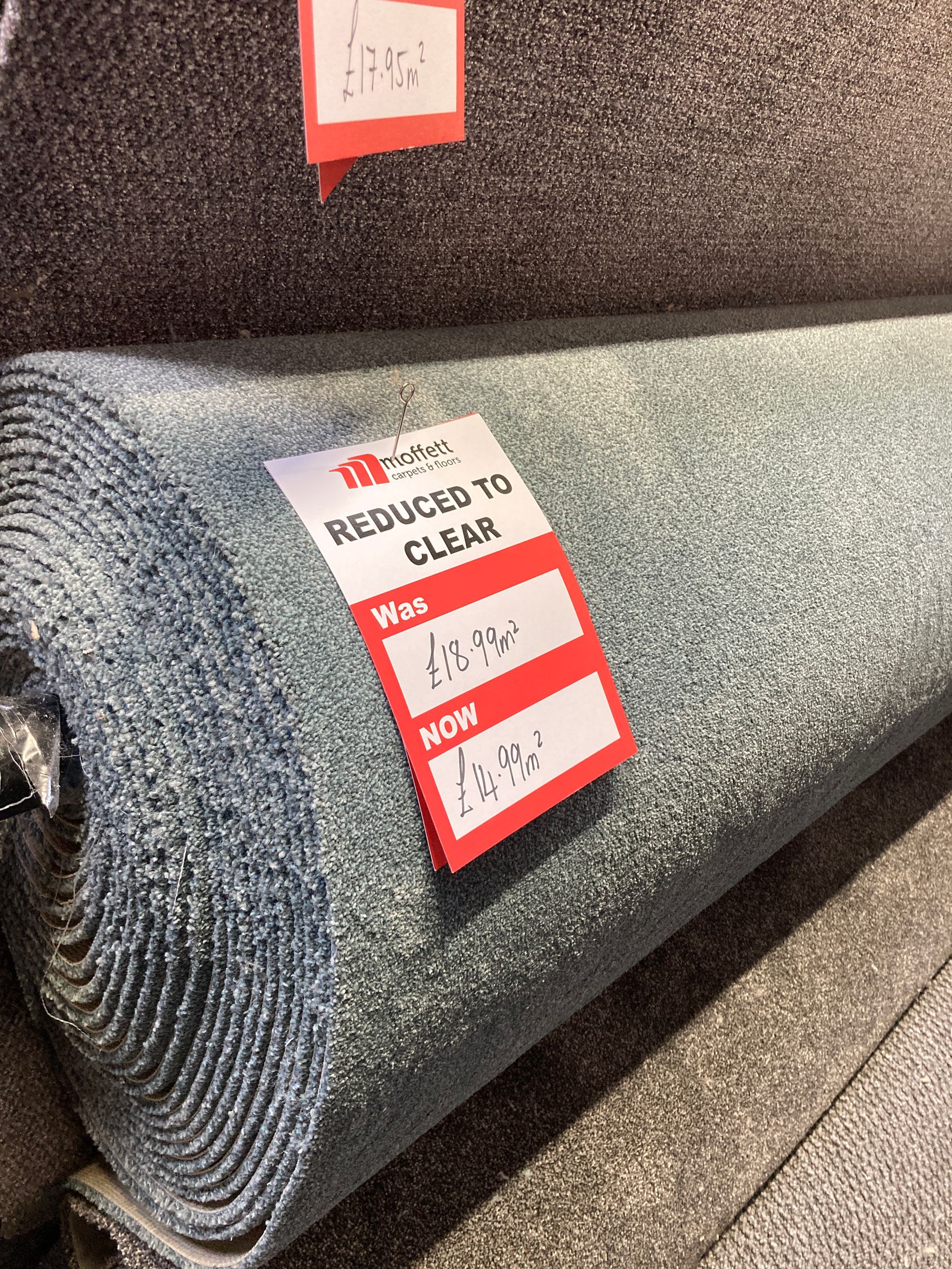 Roll of light blue carpet with 