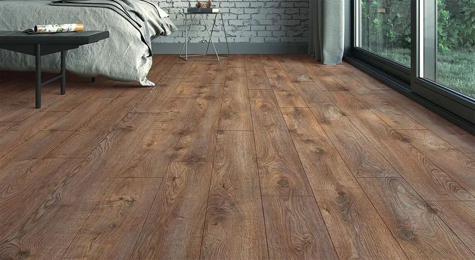 A bedroom with a wooden floor and a bed.
