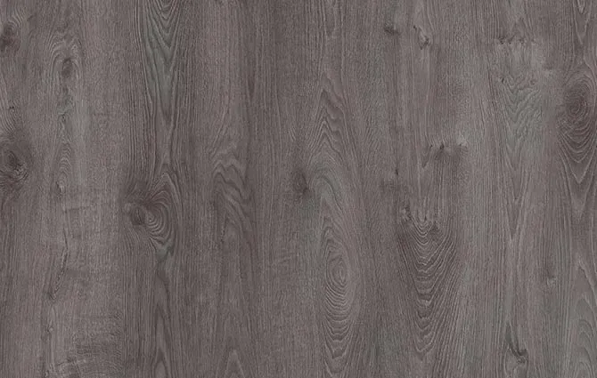 There is a table and chairs in the room with a wooden floor.