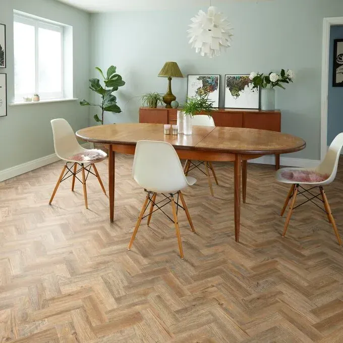 A dining room with a wooden table and chairs