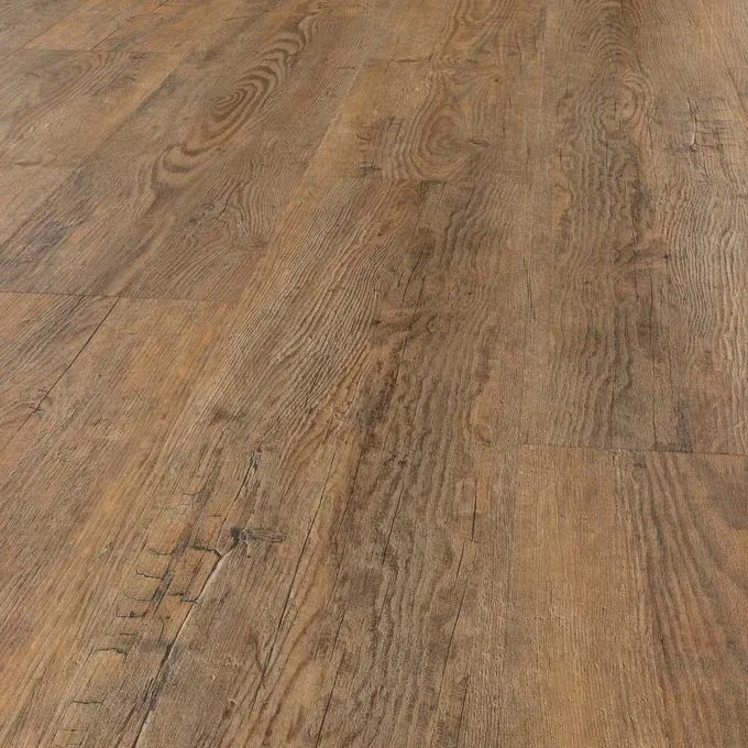 Two wicker chairs are sitting next to each other on a wooden floor in a living room.