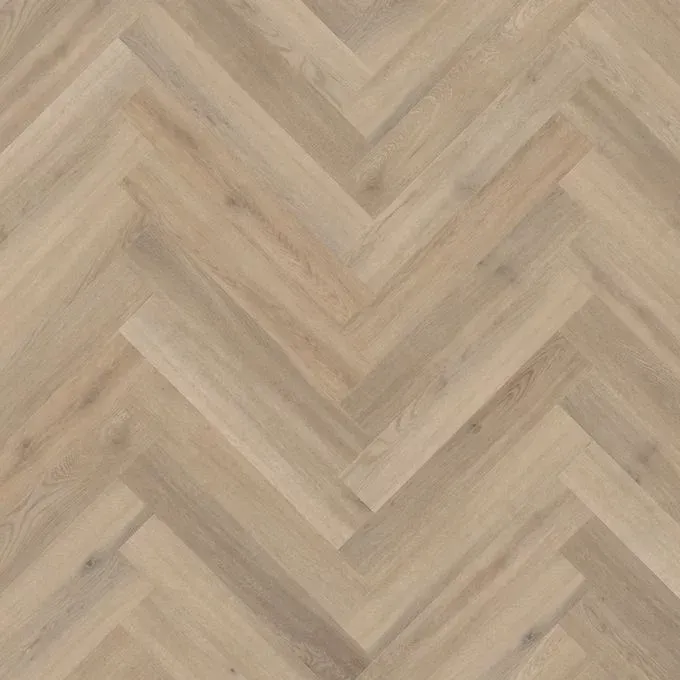 A kitchen with a herringbone floor and two stools.