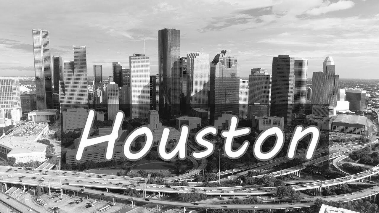 A black and white photo of the skyline of houston , texas.