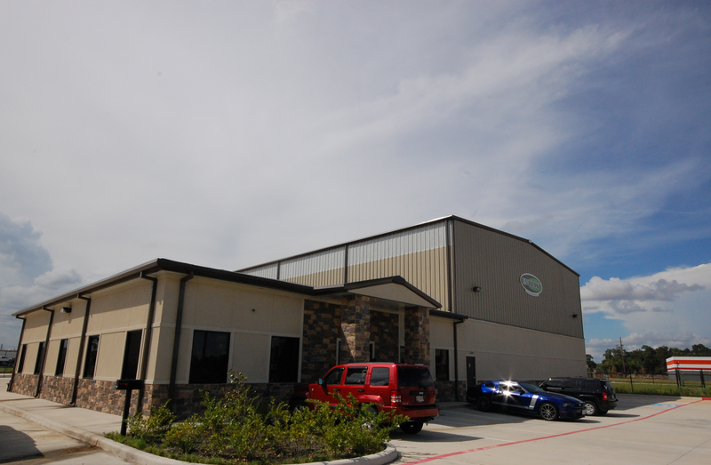 A large building with cars parked in front of it