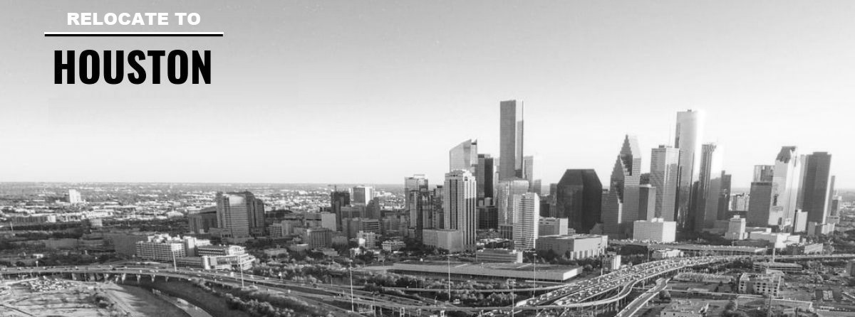 A black and white photo of the skyline of houston , texas.
