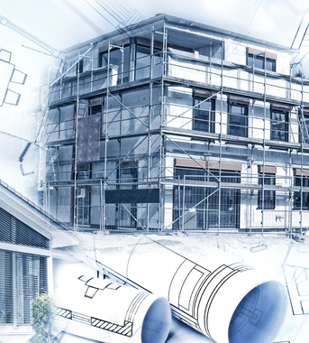 A building under construction with blueprints and scaffolding