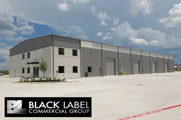 A large building with a sign that says black label commercial group