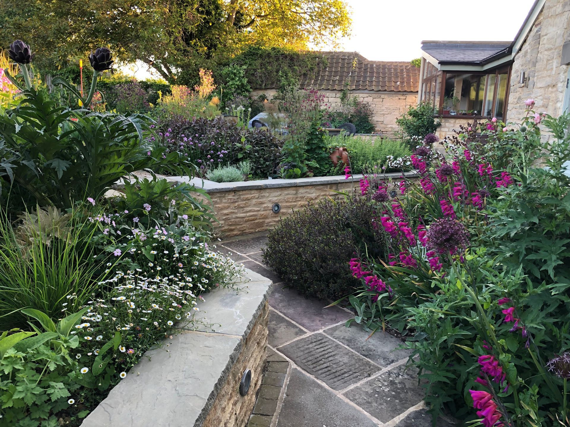 Garden design, planting, wildlife-friendly, reclaimed flagstones, cotswold, cottage, farmhouse, naturalistic, herbs, English