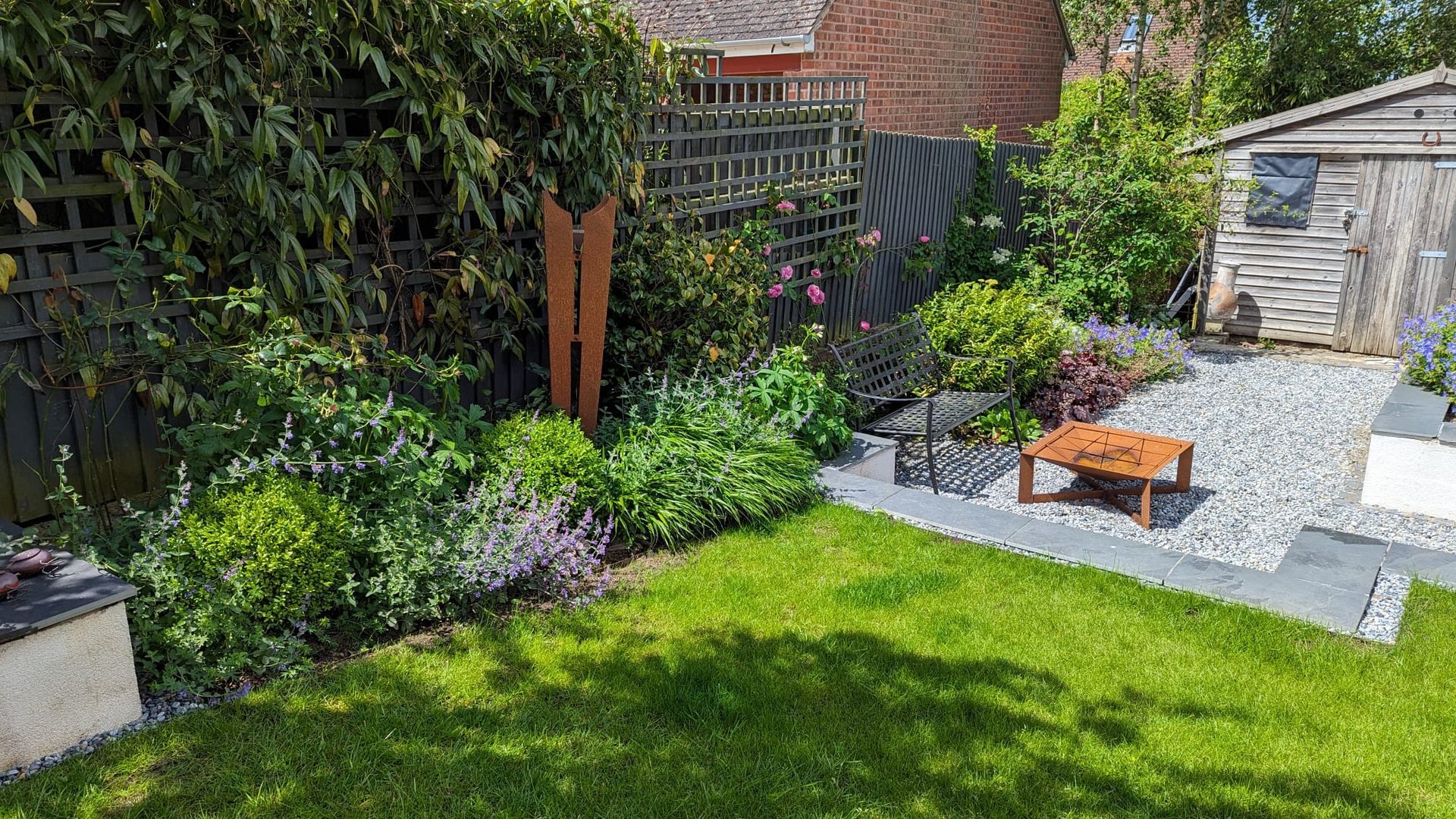 Garden design, suburban, urban, planting, bench, trellis fence, cottage, gravel, lawn, sunken seating, shed, fire pit