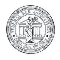 The seal of the federal bar association shows a woman holding scales of justice.