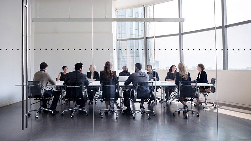 People meeting around a large table