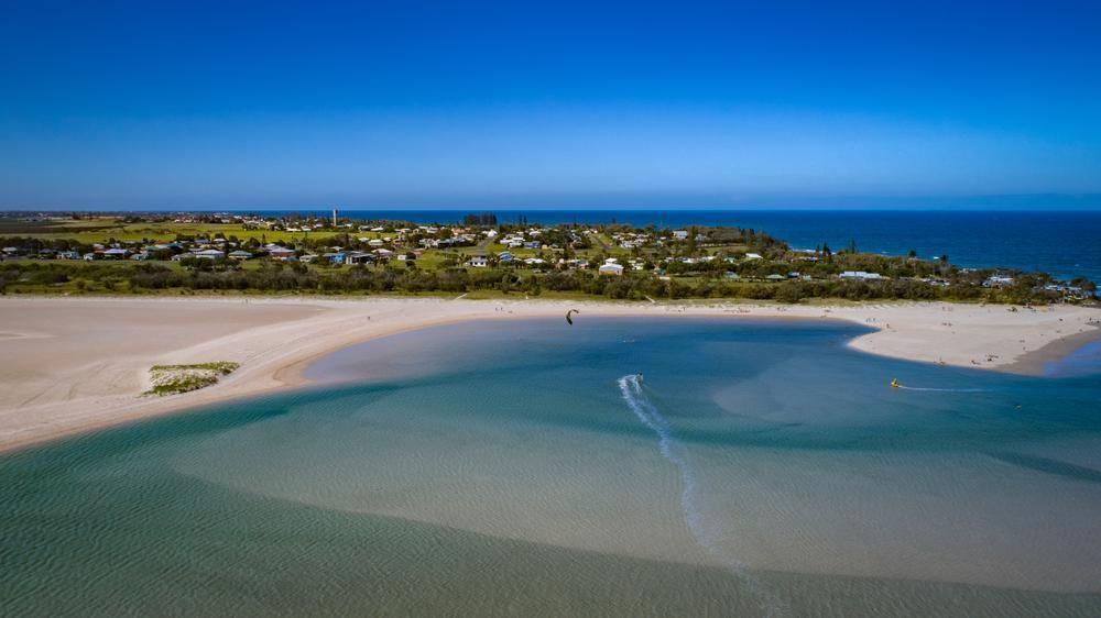 An Aerial View of a Beach and a Body of Water — Bargara Removals in Elliott Heads, QLD