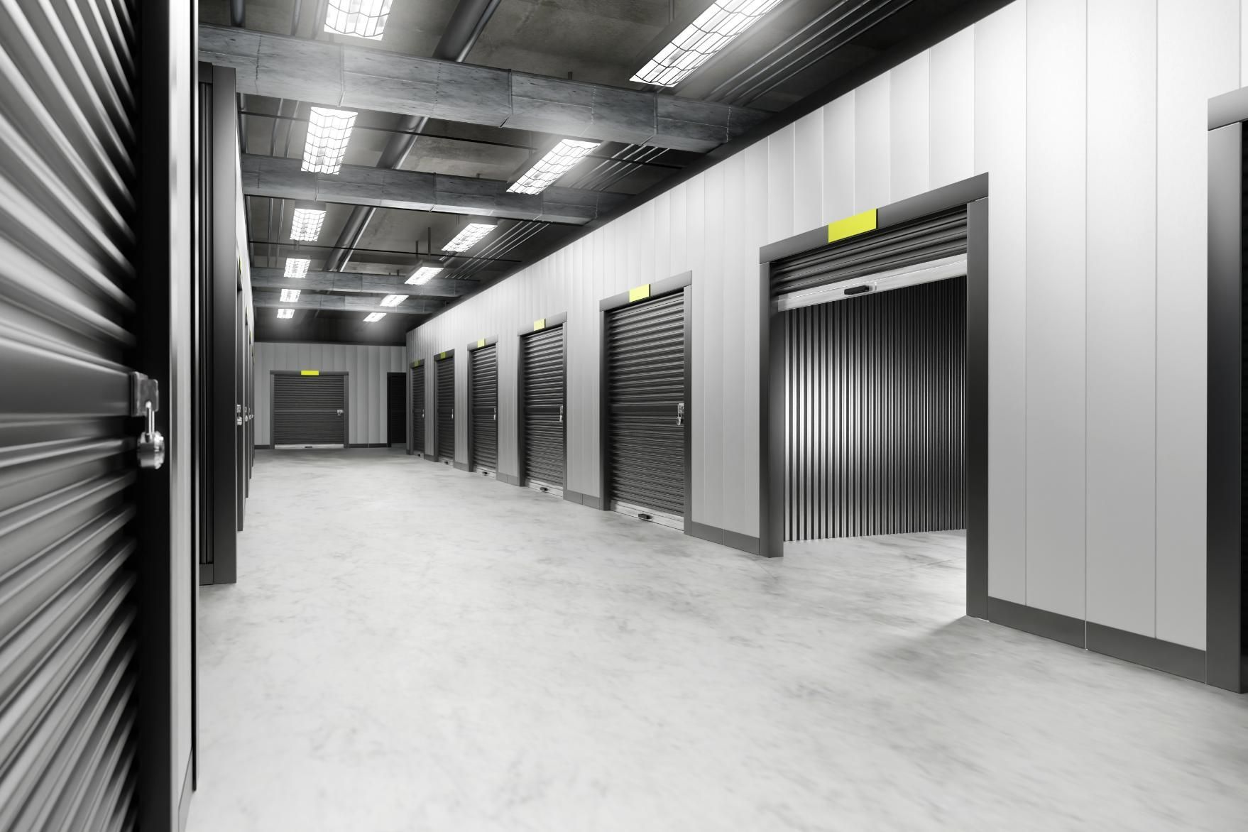 Long Hallway With a Row of Empty Storage Units — Bargara Removals in Innes Park, QLD