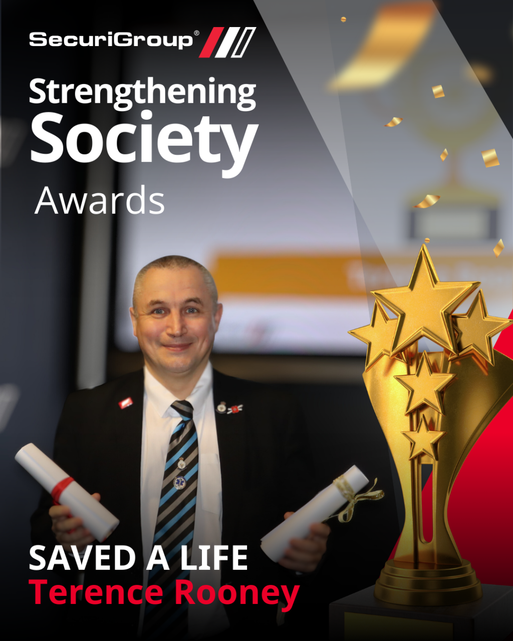 Terence Rooney holds two award certificates next to a gold trophy, celebrating a SecuriGroup "Saved a Life" award.