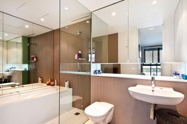 A bathroom with a toilet a sink and a bathtub