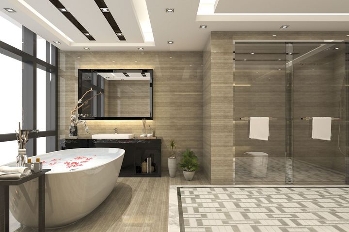 A bathroom with a bathtub , sink , mirror and walk in shower.