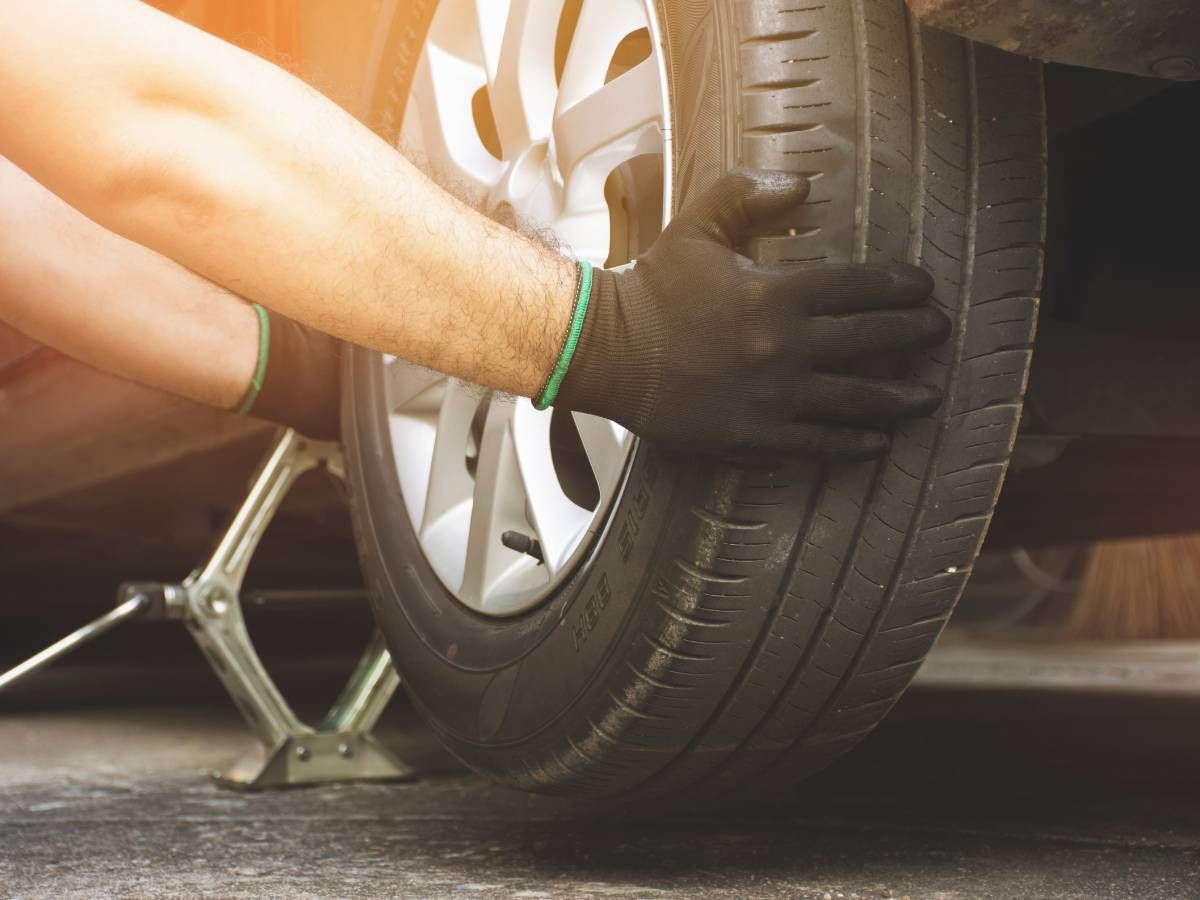Removing an old tyre before fitting a new one in Reading