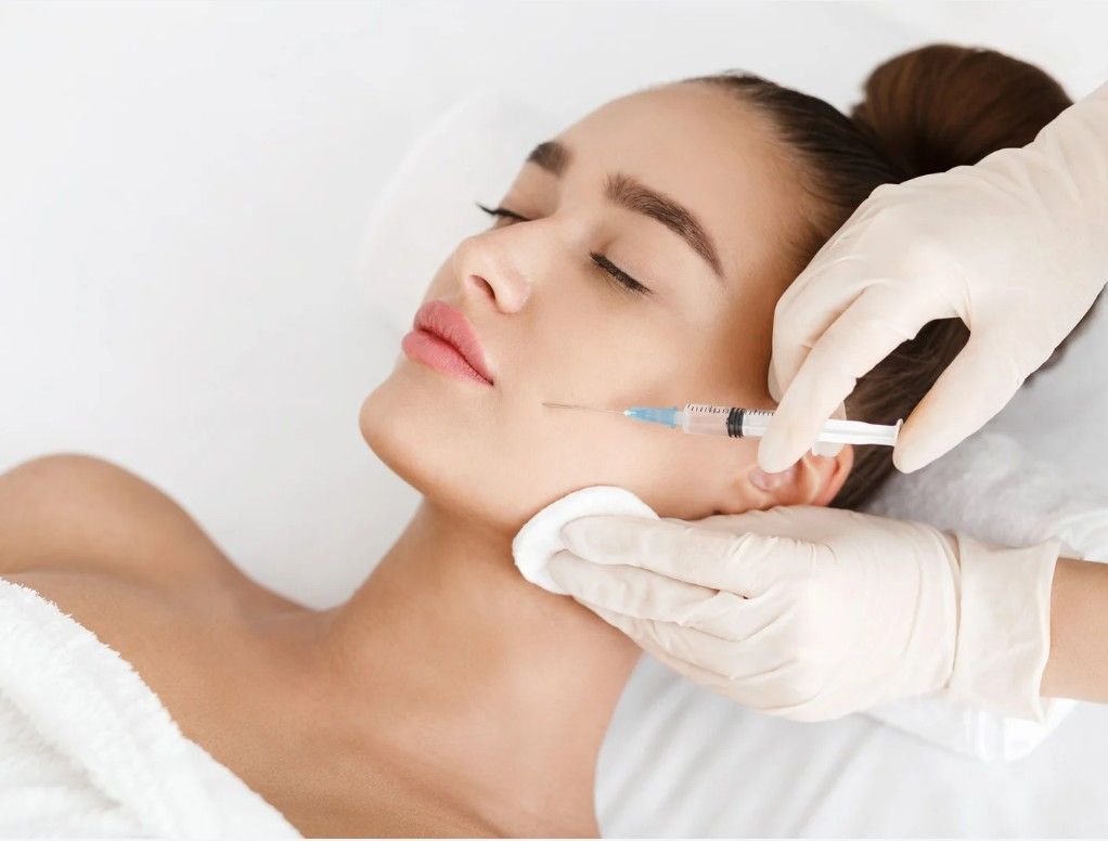 Signature Aesthetics injecting jaw filler for a client in Nottingham