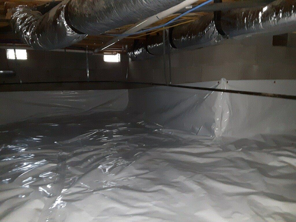 A basement with a lot of plastic covering it