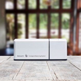 A white box is sitting on top of a wooden table.