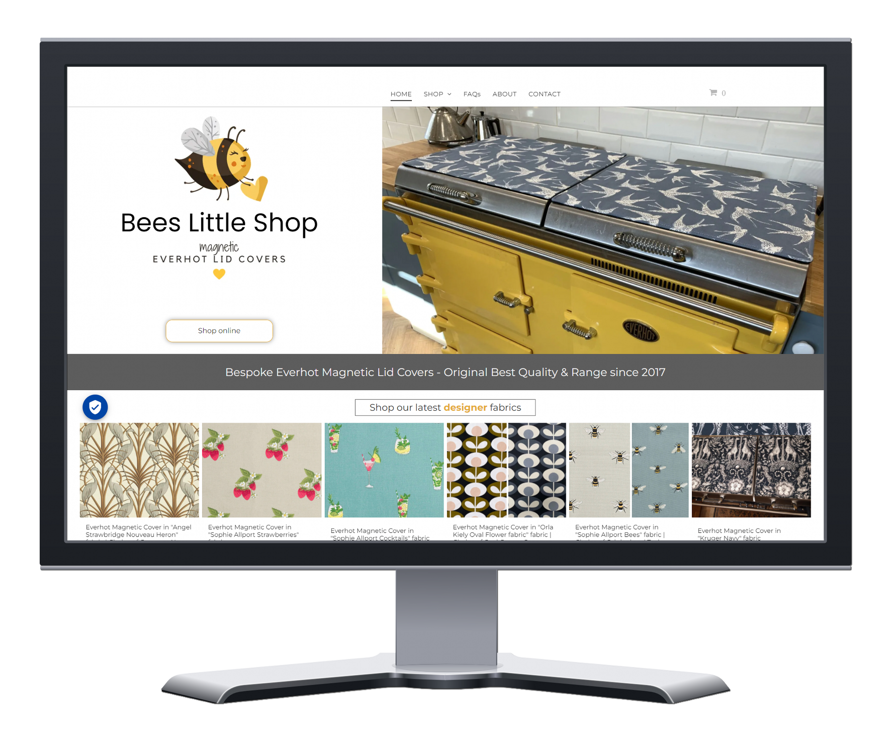 A computer monitor is displaying a website for baes little shop.
