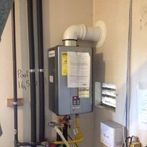 Fast Track Plumbing tankless water heater technician performing Tankless Water Heater Installation Spring, TX.