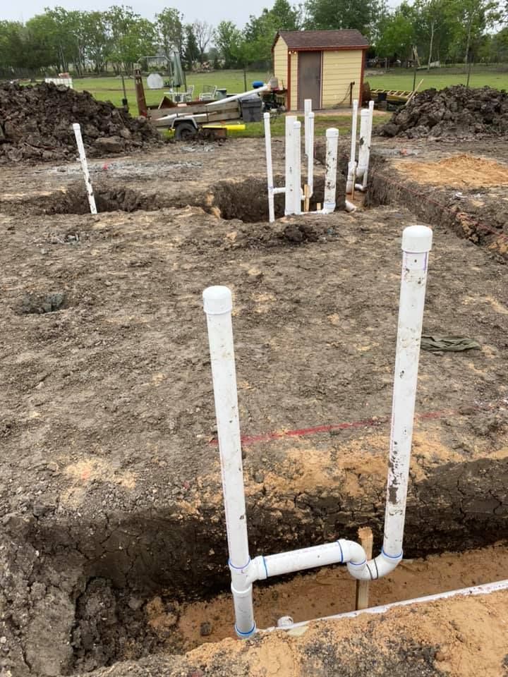Fast Track Plumbing installing PVC pipe stubs for Plumbing Installation Spring TX at a construction site.