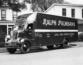 Black and white photo of a moving truck, 