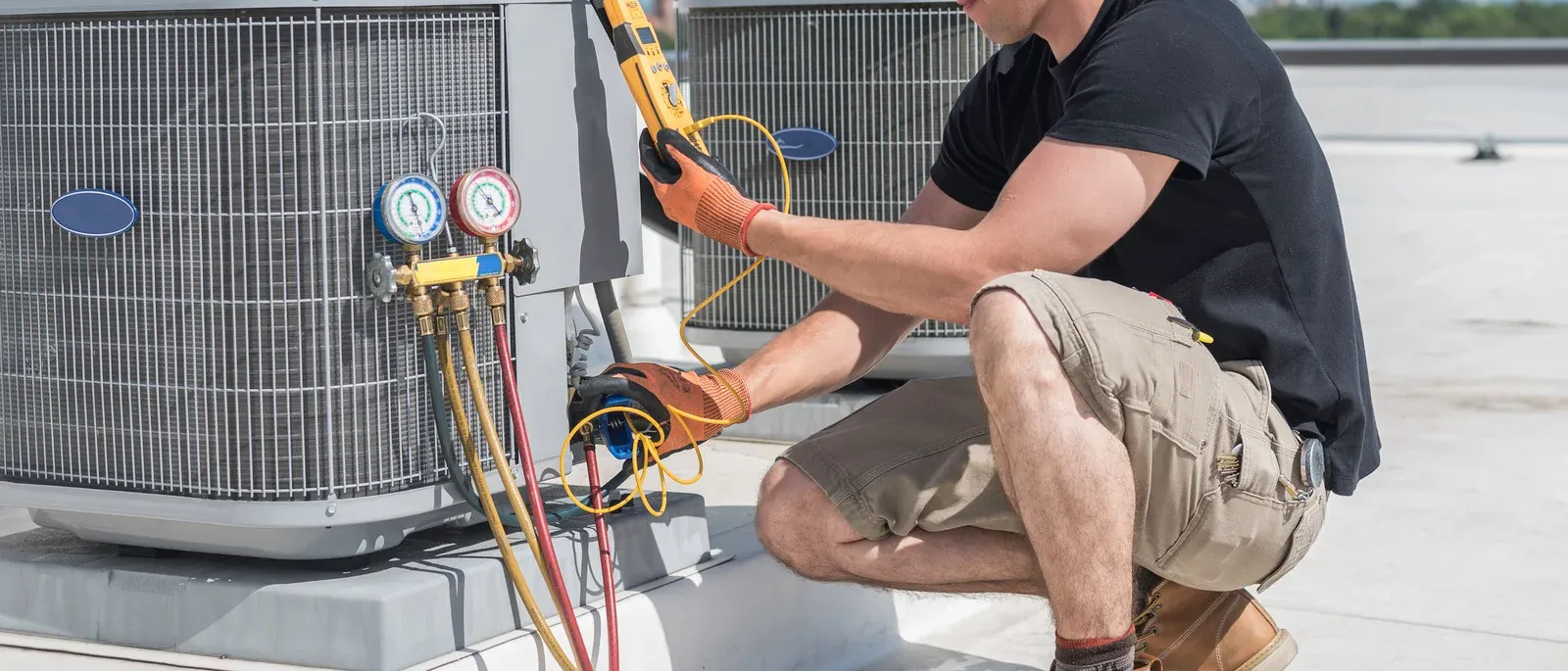 Person changing a dirty air filter in a furnace.